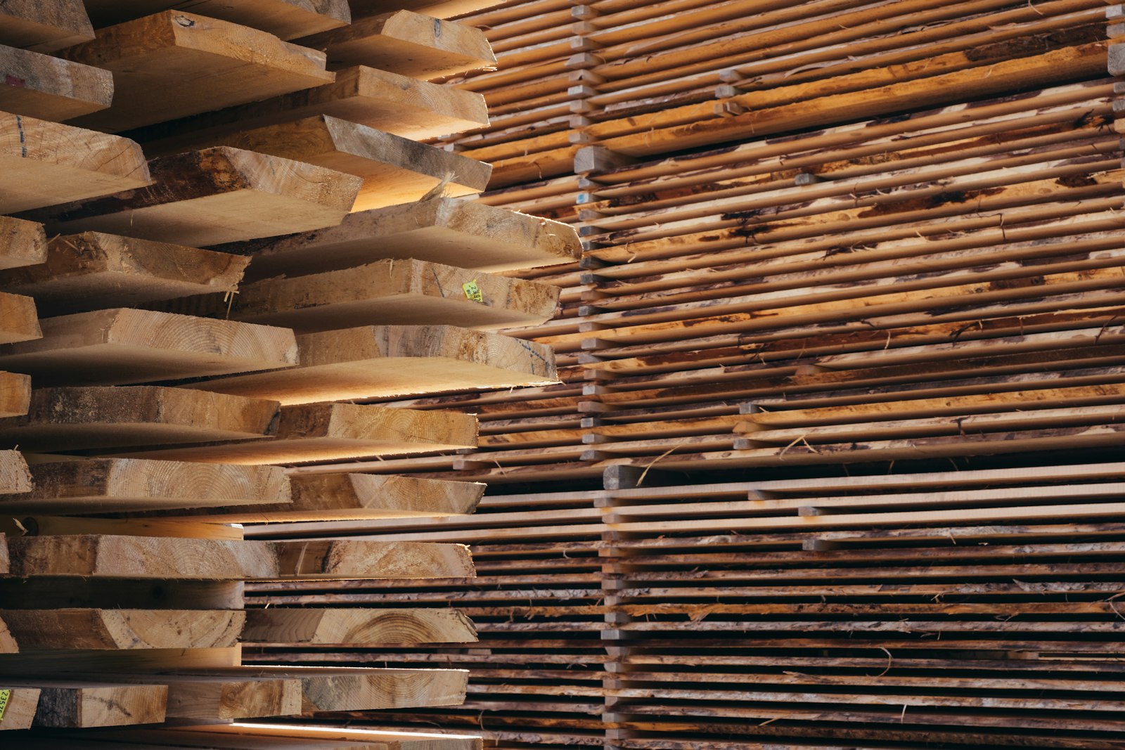 Sawn boards stacked on bearers in an open-sided timber shed