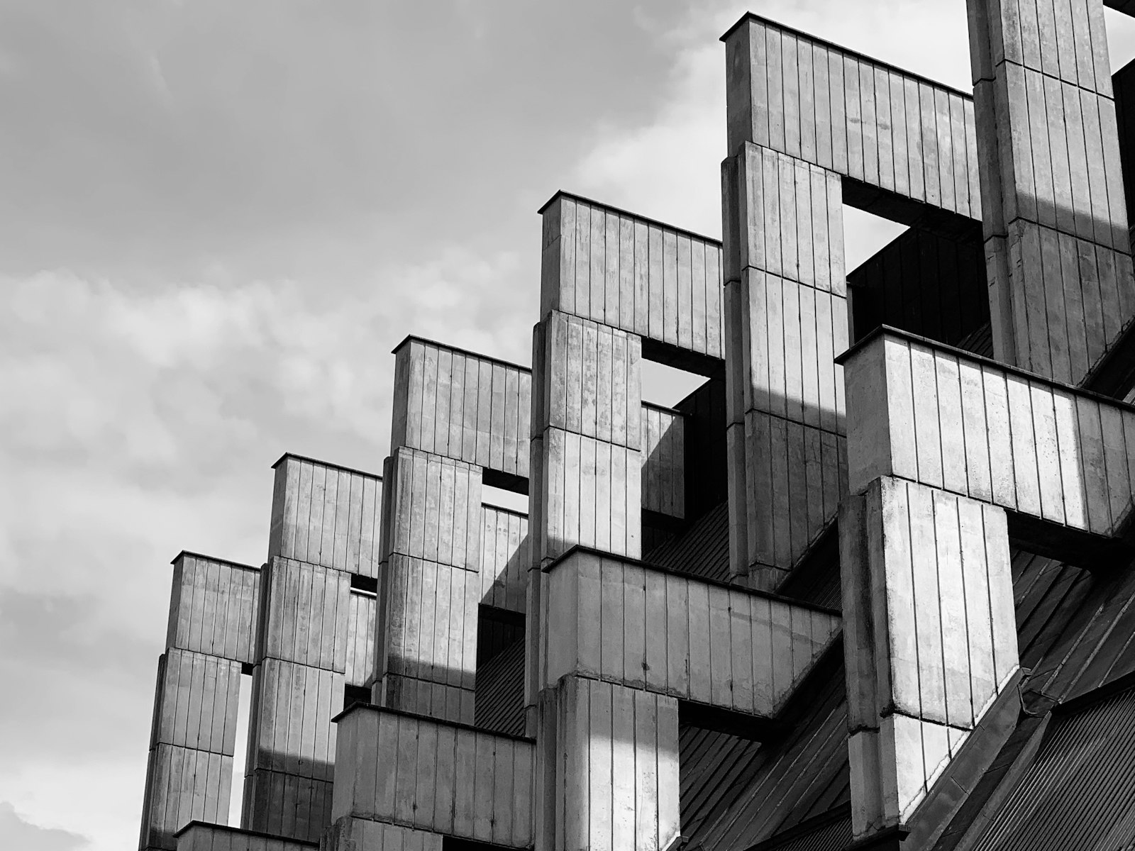 Stacked concrete blocks against a cloudy sky