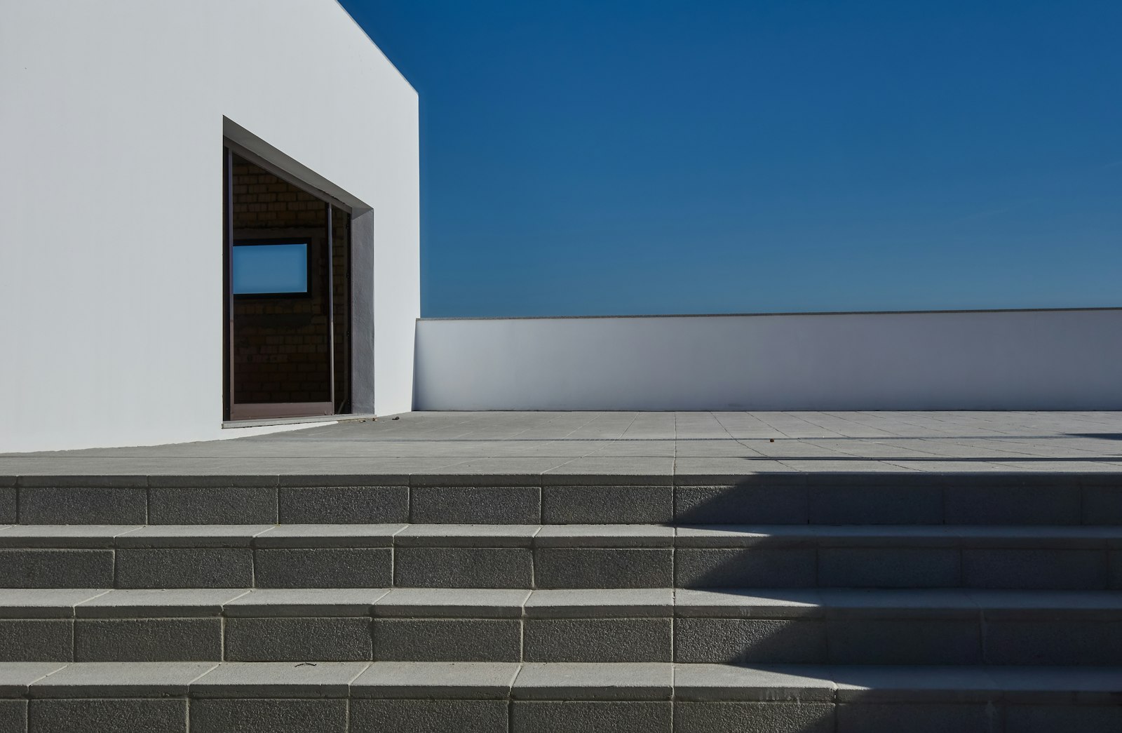 White building above wide concrete steps