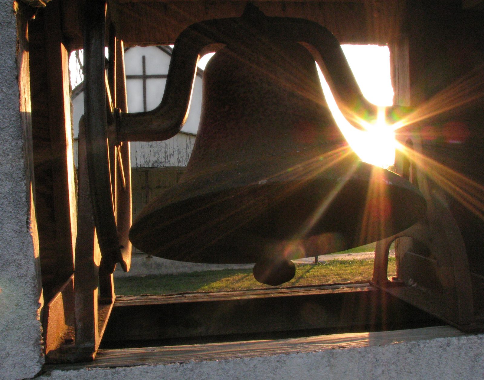 A bell against the louvres, late afternoon