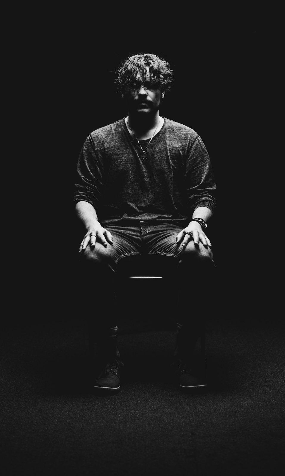 Studio founder seated on a chair