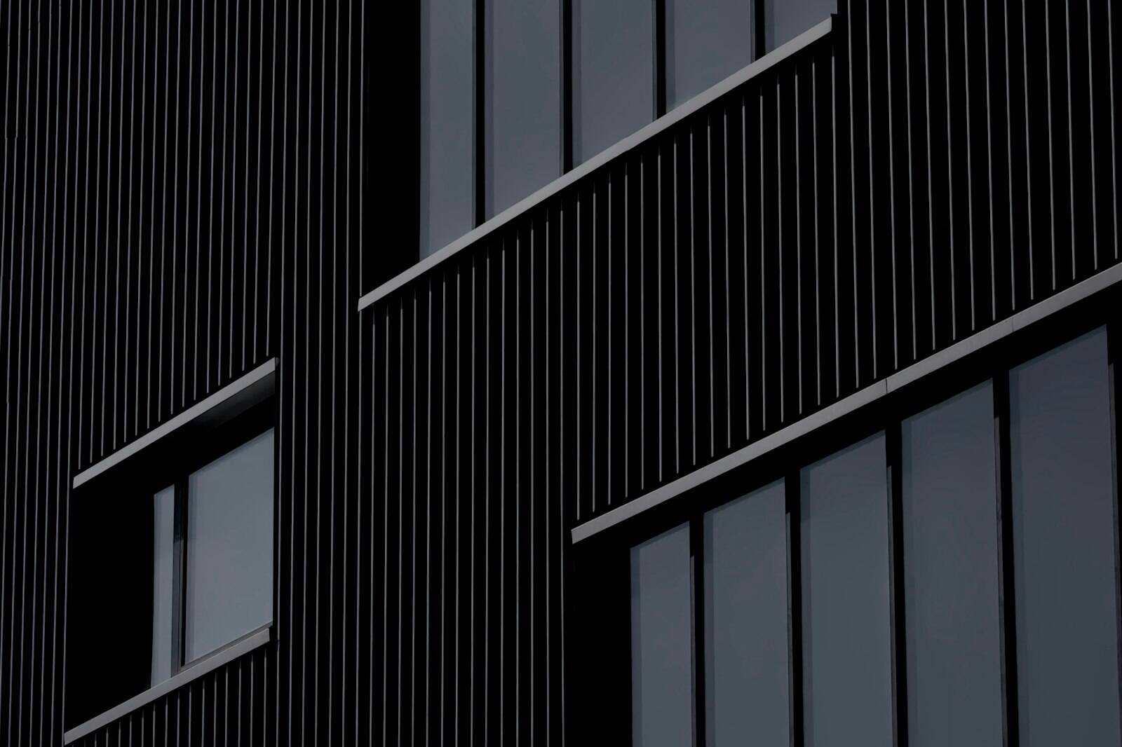 Dark ribbed building facade